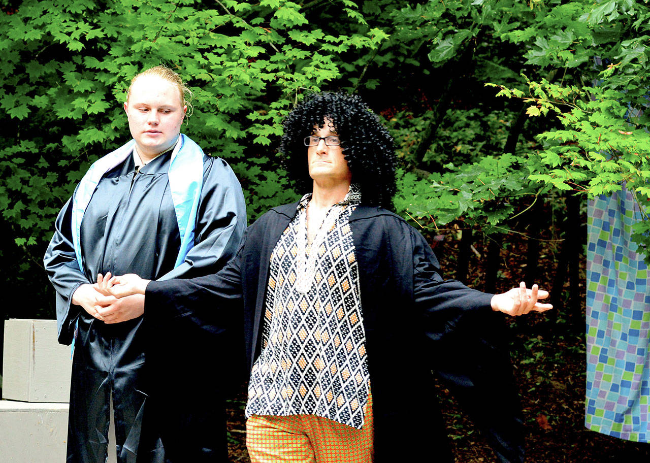 Lucentio (Cole Walsh), left, and Hortensio (Josh Sutcliffe) compete for the same woman’s attention in “The Taming of the Shrew.” Shakespeare’s comedy has its last three shows this weekend in Webster’s Woods at the Port Angeles Fine Arts Center. (Diane Urbani de la Paz/for Peninsula Daily News)