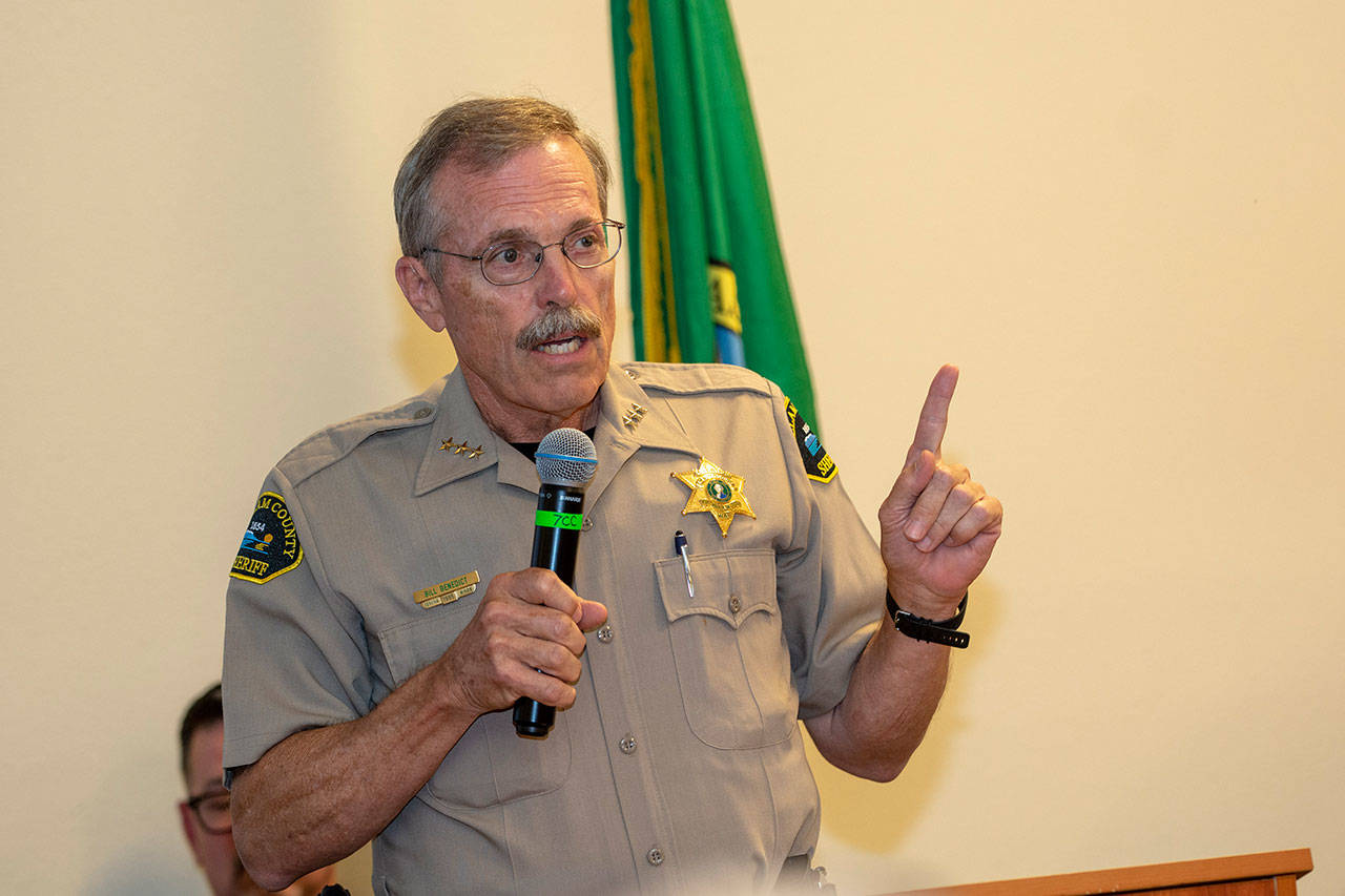 Clallam County Sheriff Bill Benedict tells the crowd at the Jamestown S’Klallam Tribe’s town hall meeting last week that he visited the facility the tribe’s proposed medication-assisted treatment center is modeled after. (Jesse Major/Peninsula Daily News)