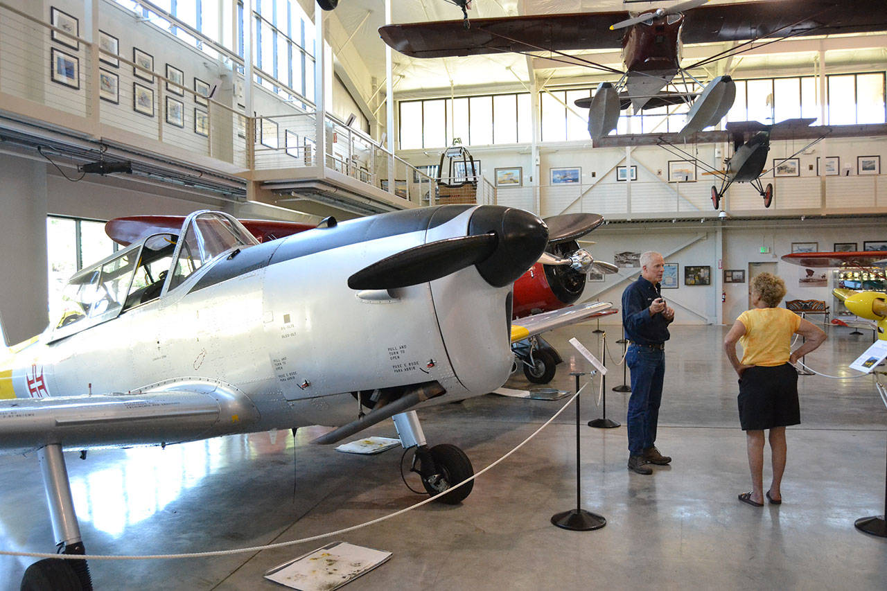 Michael Payne, director of the Port Townsend Aero Museum, talks to Emily Westcott about the planes he plans to bring to the Olympic Peninsula Air Affaire and Sequim Valley Fly-in this weekend. Tentatively, he and other pilots plan to bring three planes dating back to 1928. (Matthew Nash/Olympic Peninsula News Group)