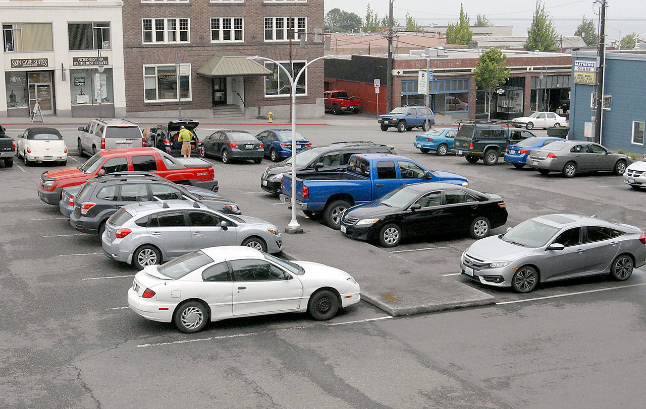 A city-owned parking lot at First and Lincoln streets in downtown Port Angeles could see the elimination of parking regulations currently being discussed by the Port Angeles City Council. (Keith Thorpe/Peninsula Daily News)