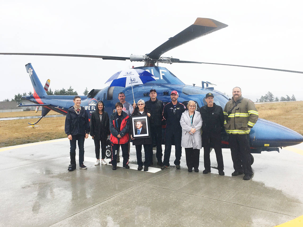 Community members and dignitaries stand with Eagle Scout candidate Ben Wright, left, during Diamond Point Airport’s Airport Appreciation event on Aug. 10 that celebrated the completion of a new helipad. (Photo courtesy of Kaye Gagnon)