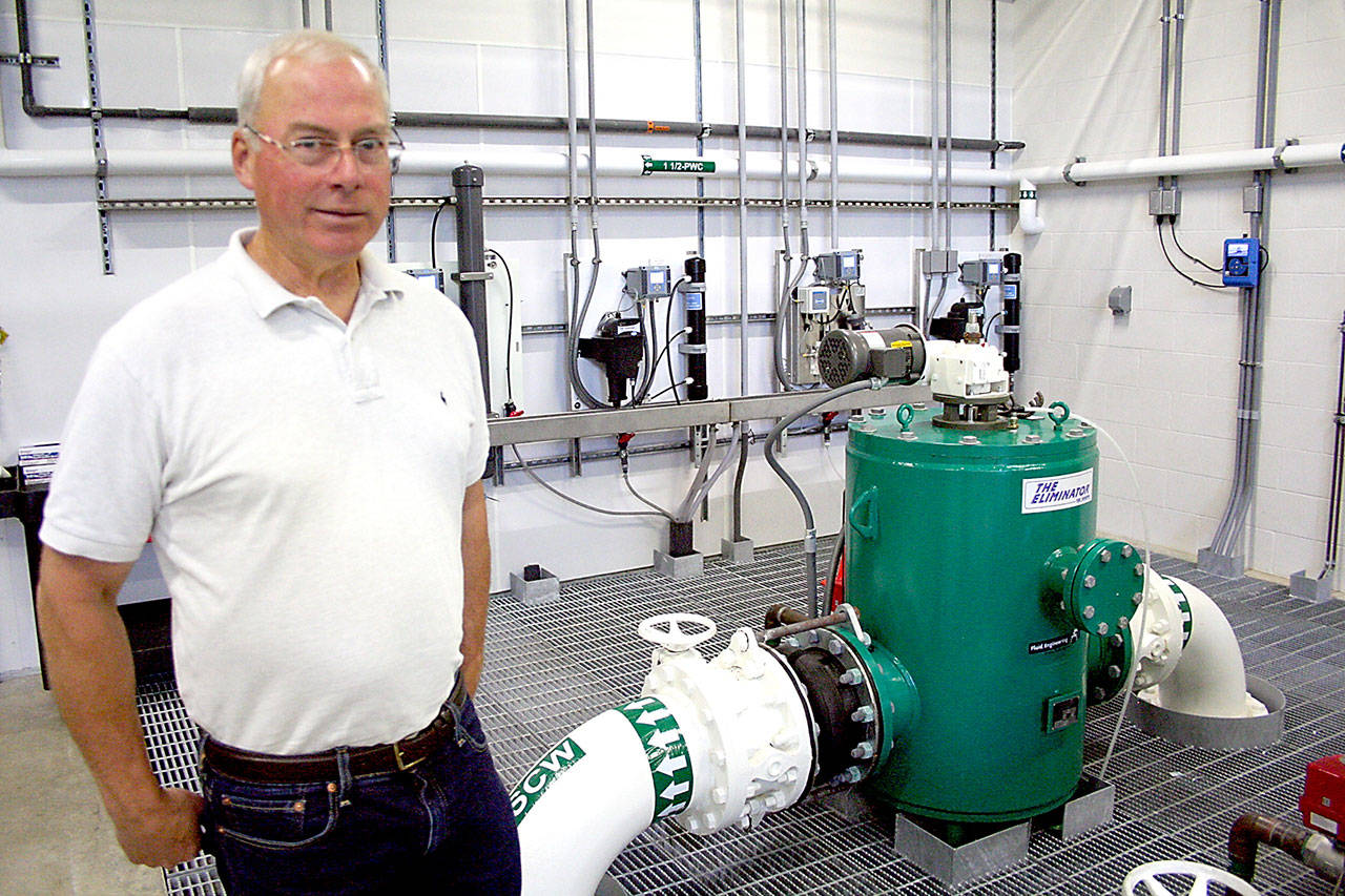 Port Townsend Water Resources Manager Ian Jablonski provides a tour of the city’s water treatment facility in July. The city took a sample from the facility last week after the chemical spraying near City Lake, and glyphosate was not found in it. (Brian McLean/Peninsula Daily News)