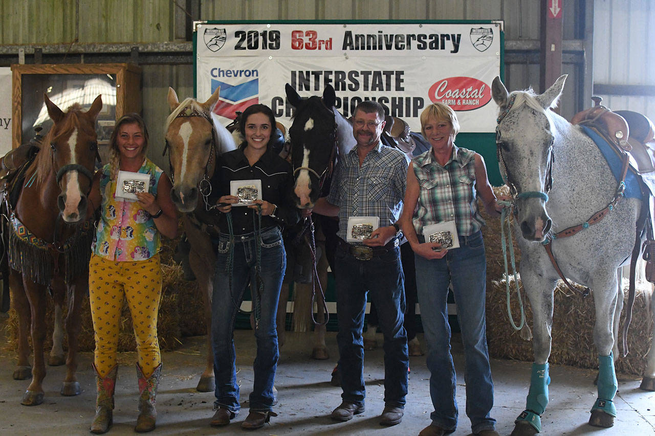 Ady Crosby, left, Emma Albright, Dan Dickson and Waynora Martin came in first place in team poles at the annual Washington vs. Oregon Interstate Championship competition last weekend. (Kenra DeAngelis/The Mane Image Photography)