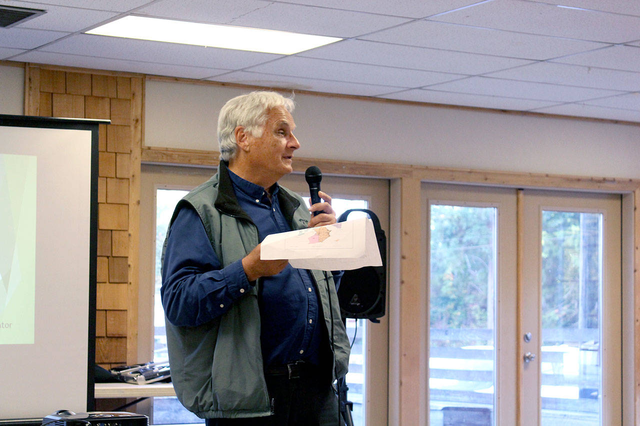 During a community outreach meeting in Quilcene, Jefferson County Assessor Jeff Chapman explains the process of assessing property in the county and invites those who don’t agree with their assessed value to talk with his team to come to an agreement. (Zach Jablonski/Peninsula Daily News)