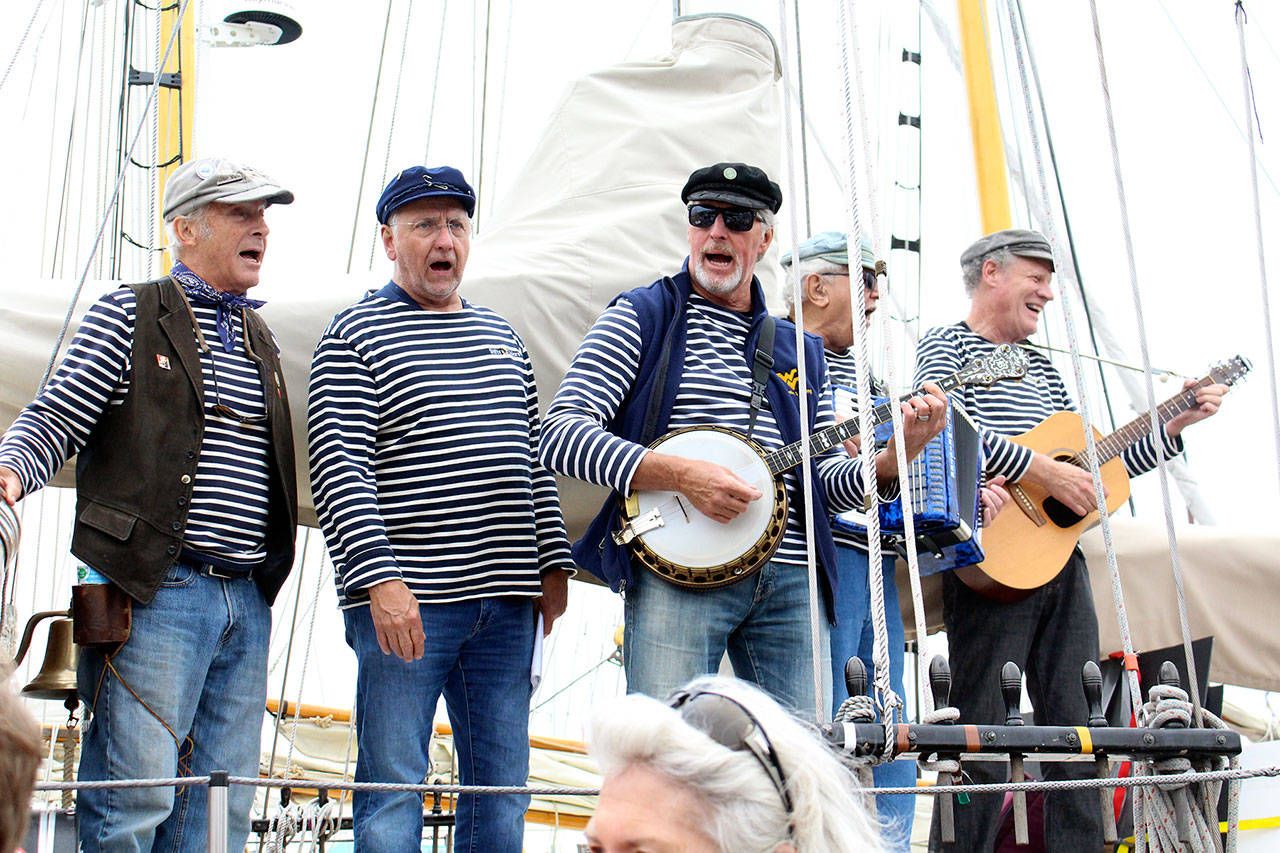 The Shifty Sailors perform on the boat Suva at the Wooden Boat Festival in Port Townsend. (Zach Jablonski/Peninsula Daily News)