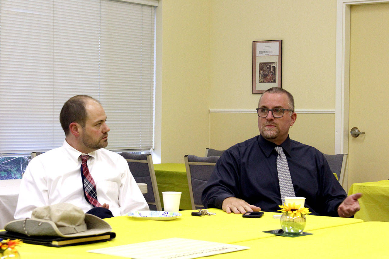 Quilcene Superintendent Frank Redmon, right, leads a discussion on a proposed new school with the assistance of Quilcene Principal Sean Moss earlier this week. (Zach Jablonski/Peninsula Daily News)