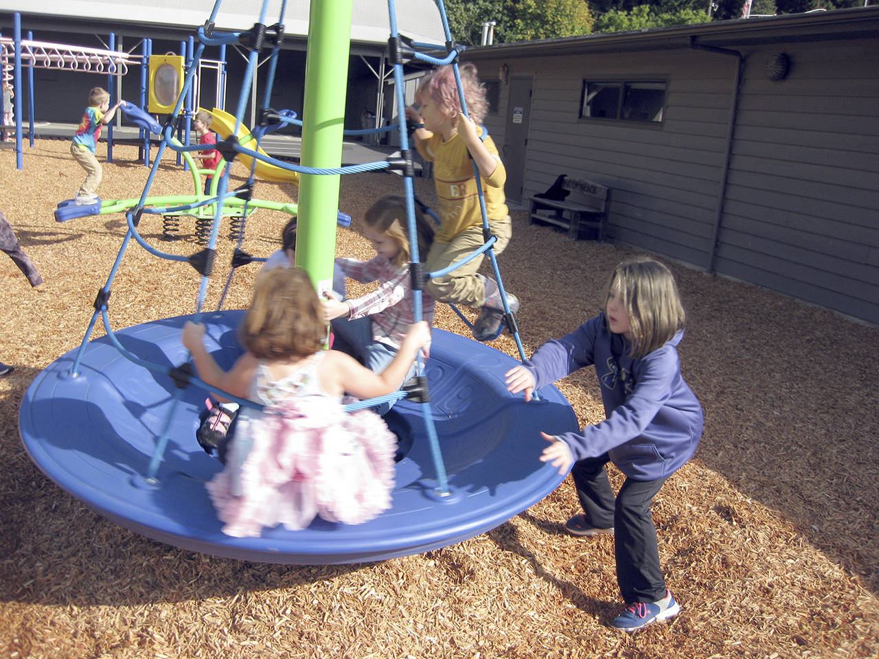 Playing on Brinnon Schools new playground equipment Wednesday are Chloe Edwards, Grace Koipish, Annika Morris, Lumina Clark and Chloe Lester. (Britney Edwards)