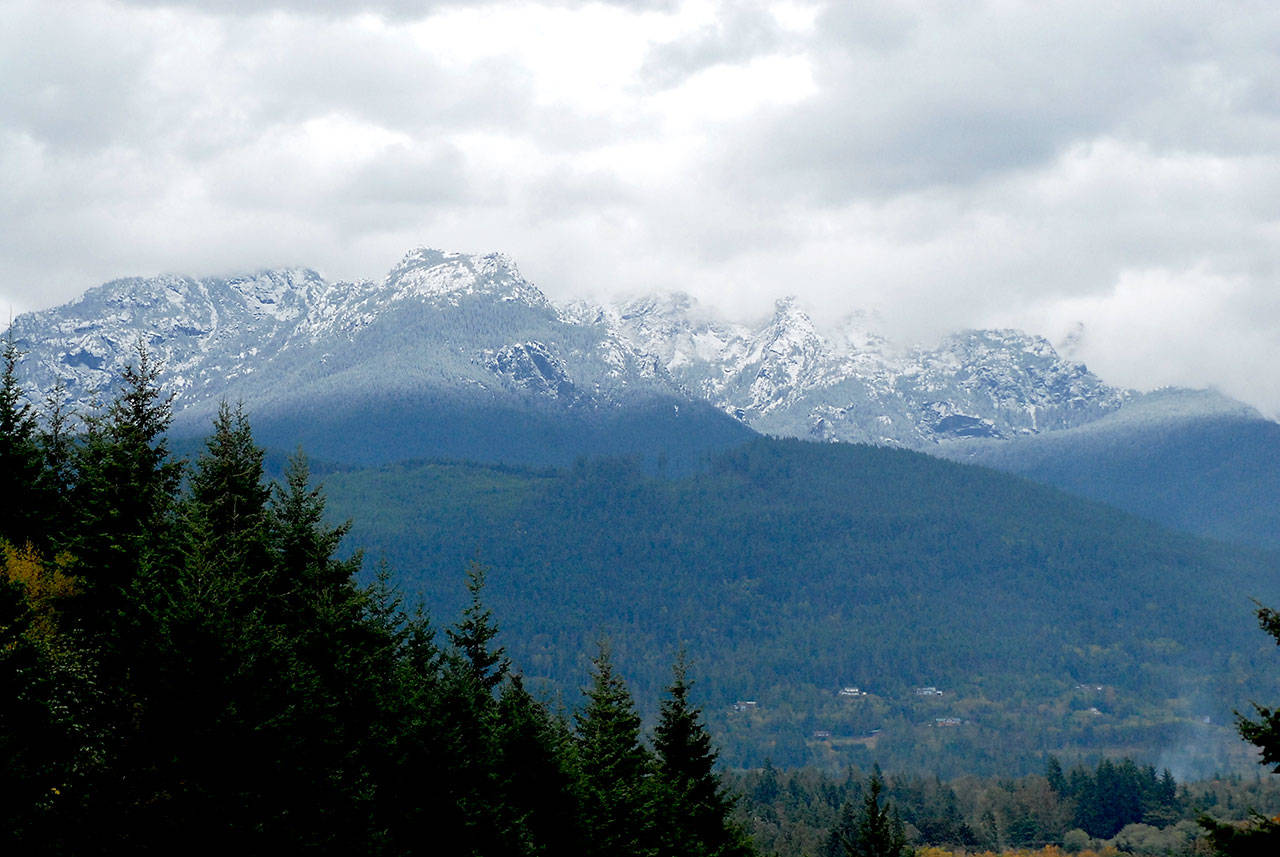 Snow blankets Klahhane Ridge and the Olympic Mountains south of Port Angeles on Saturday after the first major snowfall of the season. (Keith Thorpe/Peninsula Daily News)