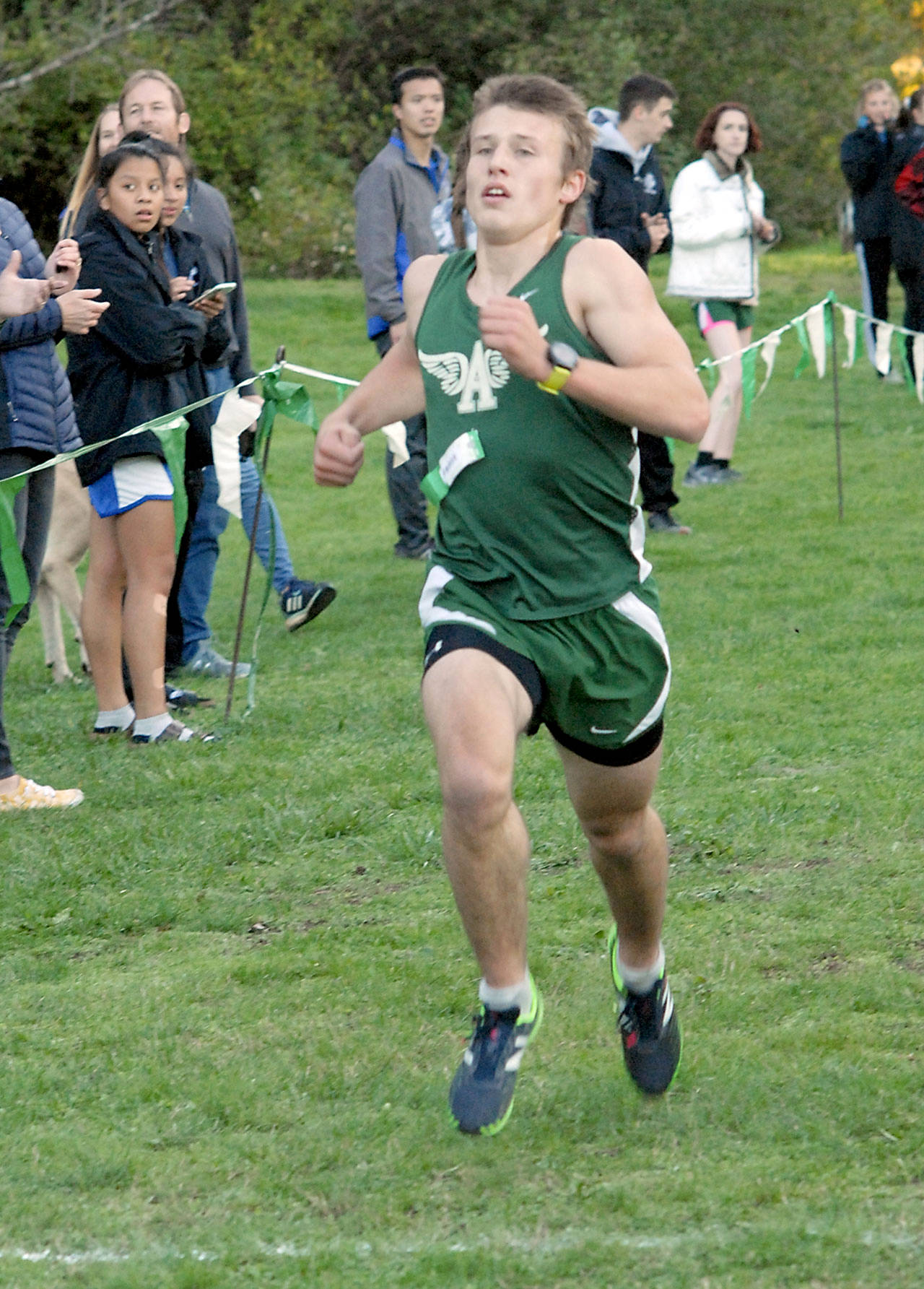 Port Angeles’ Adam Borde crosses the line to take second in the boys race that included competitors from North Mason and Olympic on Wednesday at Lincoln Park in Port Angeles. (Keith Thorpe/Peninsula Daily News)