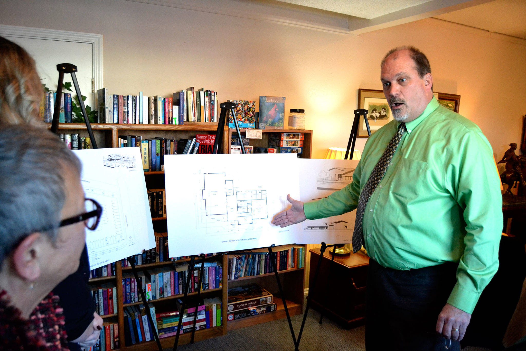 <strong>Matthew Nash</strong>/Olympic Peninsula News Group                                Michael Smith, executive director of the Shipley Center, discusses plans for the center’s Health & Wellness Annex with Jan Simon, executive director of the First Federal Community Foundation, and Ashley Slezak, First Federal Sequim market manager. Smith said the proposed $1.5 million project will add about 6,400 square feet of space for exercise classes, a fitness room, sports courts, a commercial demonstration kitchen and more.