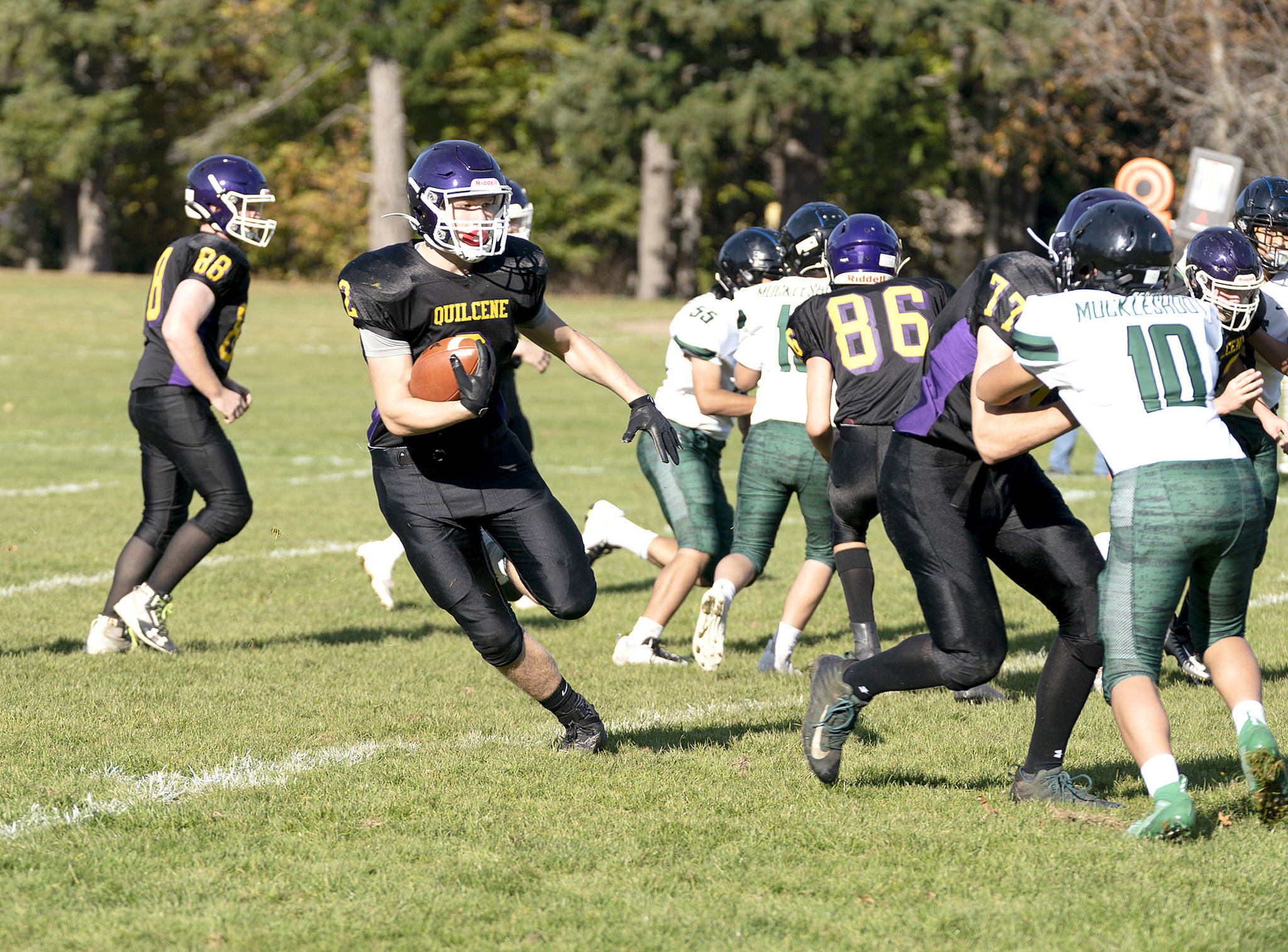 <strong>Steve Mullensky</strong>/for Peninsula Daily News                                Quilcene’s Bishop Budnek runs against Muckleshoot on Saturday in the Rangers’ 58-6 win.