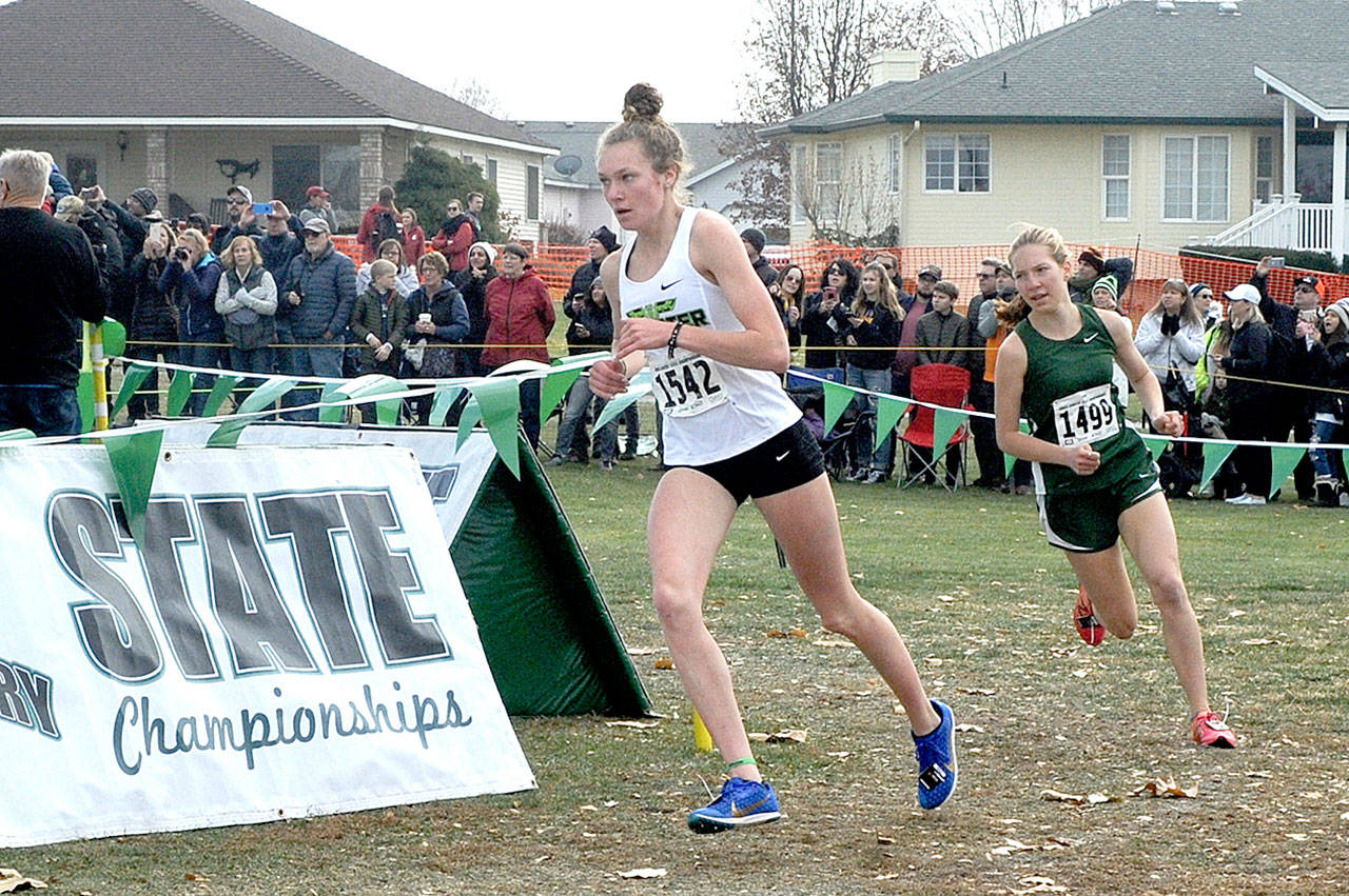 Port Angeles’ Lauren Larson, right, finished fifth in the state in the 2A Girls Cross-Country Championships on Saturday. It was Larson’s second top-5 finish at state. (Lonnie Archibald/for Peninsula Daily News)