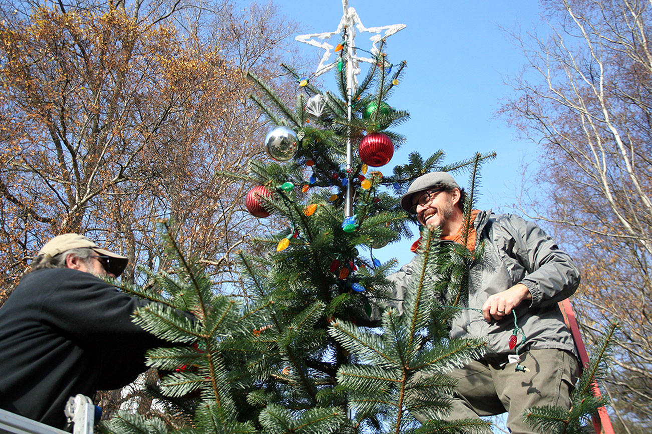 Trimming the tree in preparation for Santa in Port Townsend