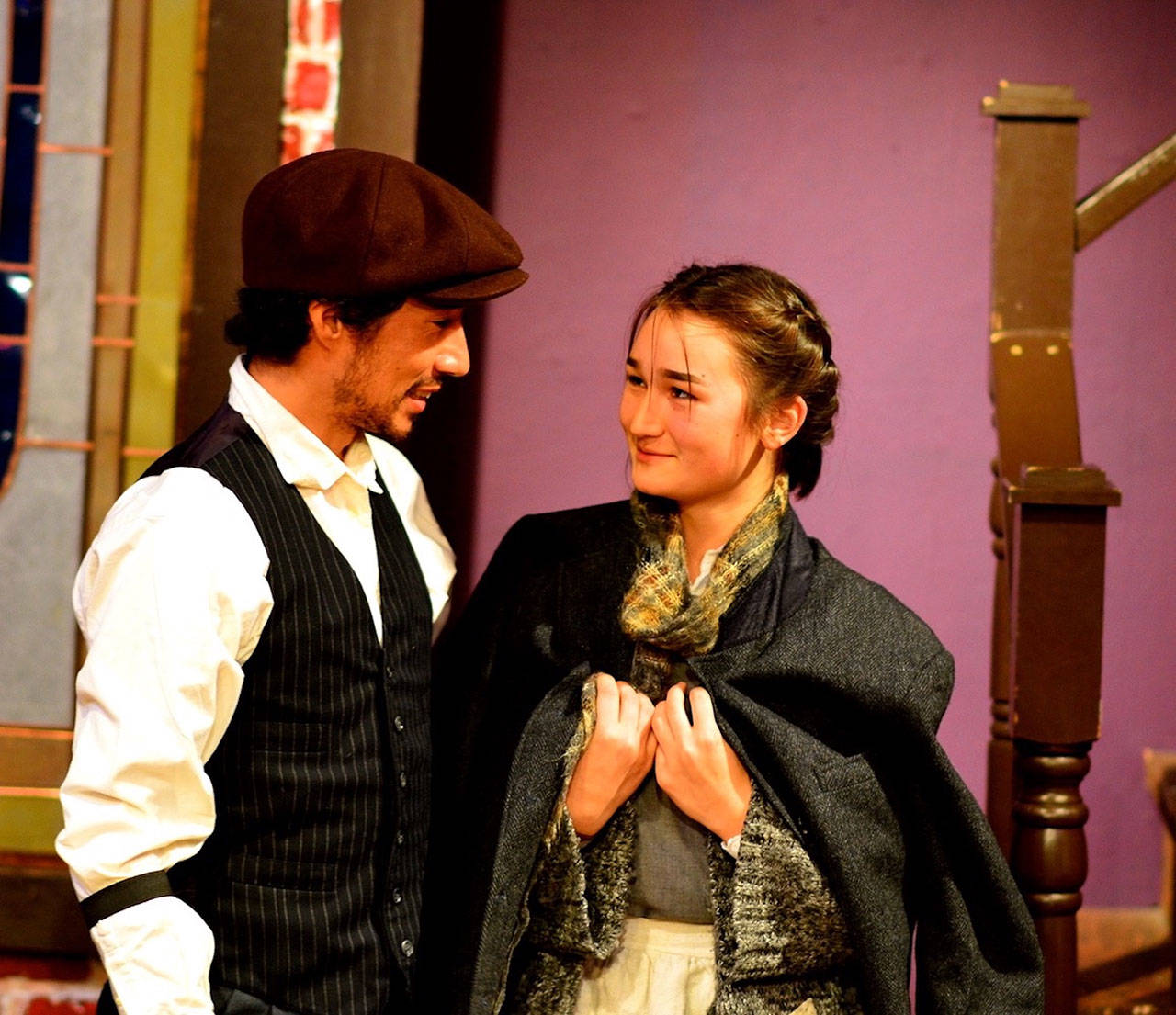 Bob Cratchit (Tomoki Sage) and Maddie Mae (Zoe Cook) seek a merry Christmas despite their boss’ Scrooginess in “Spirit of the Yule.” (Diane Urbani de la Paz/for Peninsula Daily News)