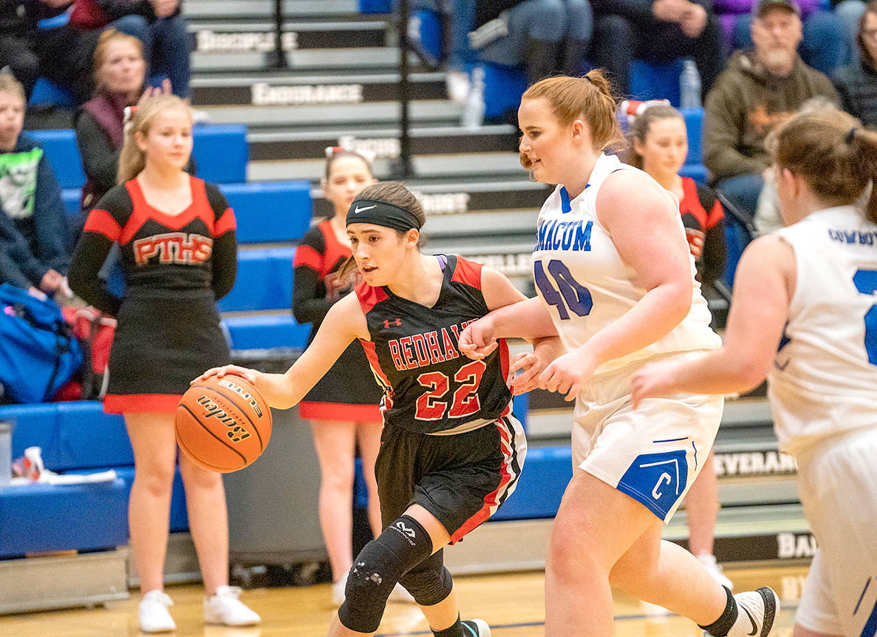 Steve Mullensky/for Peninsula Daily News Port Townsend’s So-So Johnston dribbles past Chimacum’s Amiyah Fisher during a Wednesday game in Chimacum.