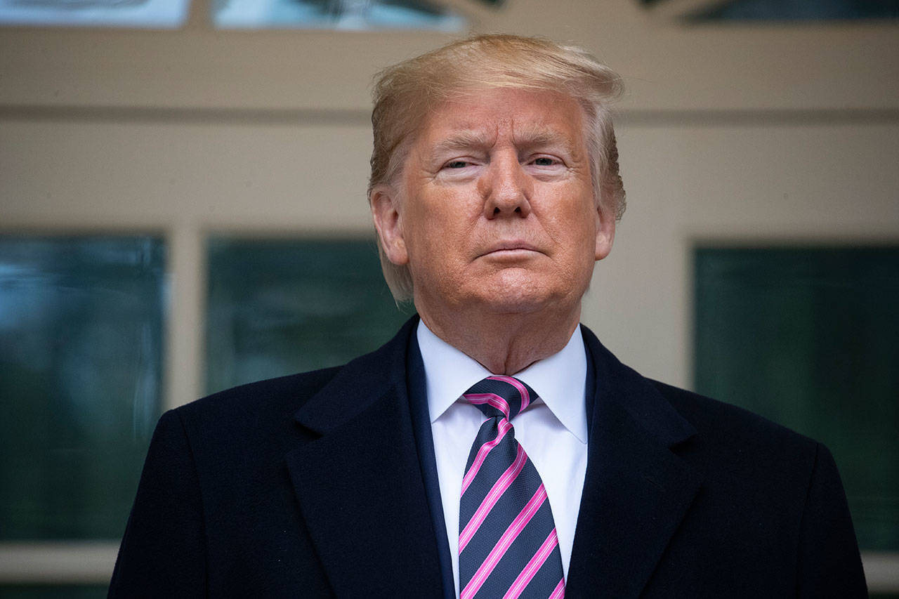 President Donald Trump poses for photos as he meets with Paraguay’s President Mario Abdo Benitez at the White House today in Washington, D.C. (AP Photo/Evan Vucci)