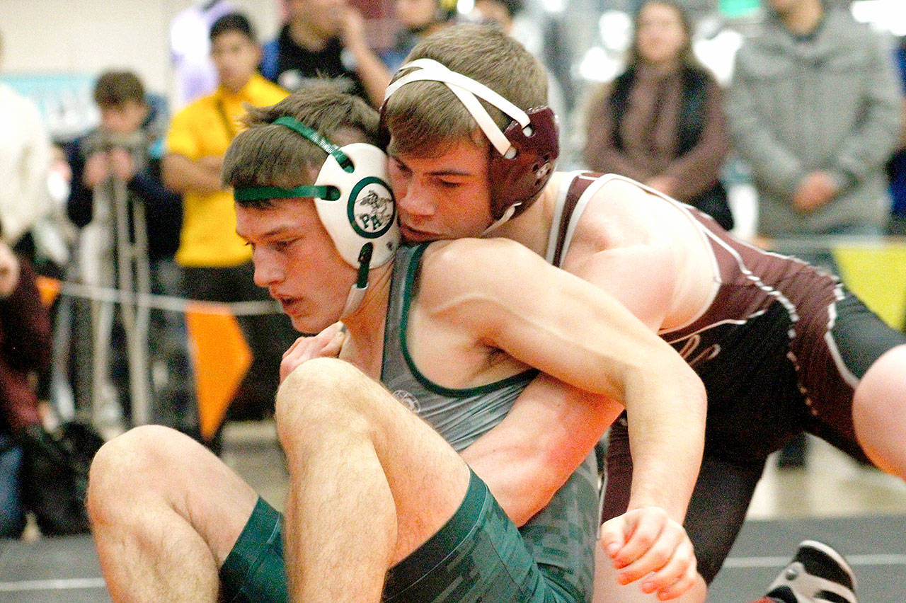 Port Angeles’ Adam Borde, left, finished second in the 138-pound weight division at the Hammerhead Invitational held in Bremerton this weekend. (Mark Krulish/Kitsap News Group)