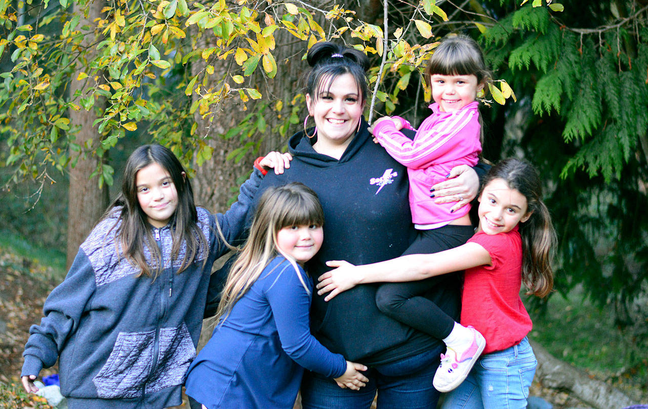 Shane Sodano of Port Townsend has her arms full with four daughters, from left, Raelynn, Carmella, Saphina and Kylie. (Diane Urbani de la Paz/For Peninsula Daily News)