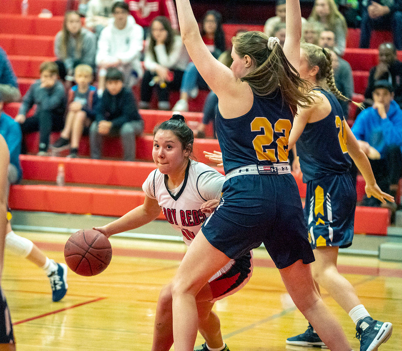 Steve Mullensky/for Peninduls Daily News Neah Bay’s Ruth Moss pushes around Burlington-Edison Tiger Brylee Axelson-Ney during a Crush in the Slush game at Port Townsend High School on Friday.