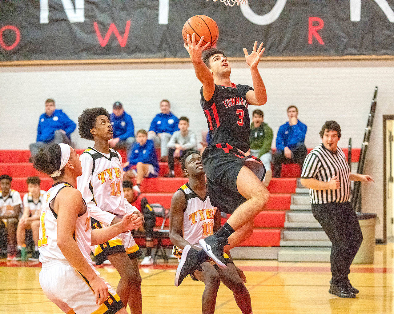 Steve Mullensky/for Peninsula Daily News Port Townsend’s Kesem Coggins goes up for a hard fought two pointer against the Tyee Totems on Saturday during the Crush in the Slush tournament at Port Townsend High School.