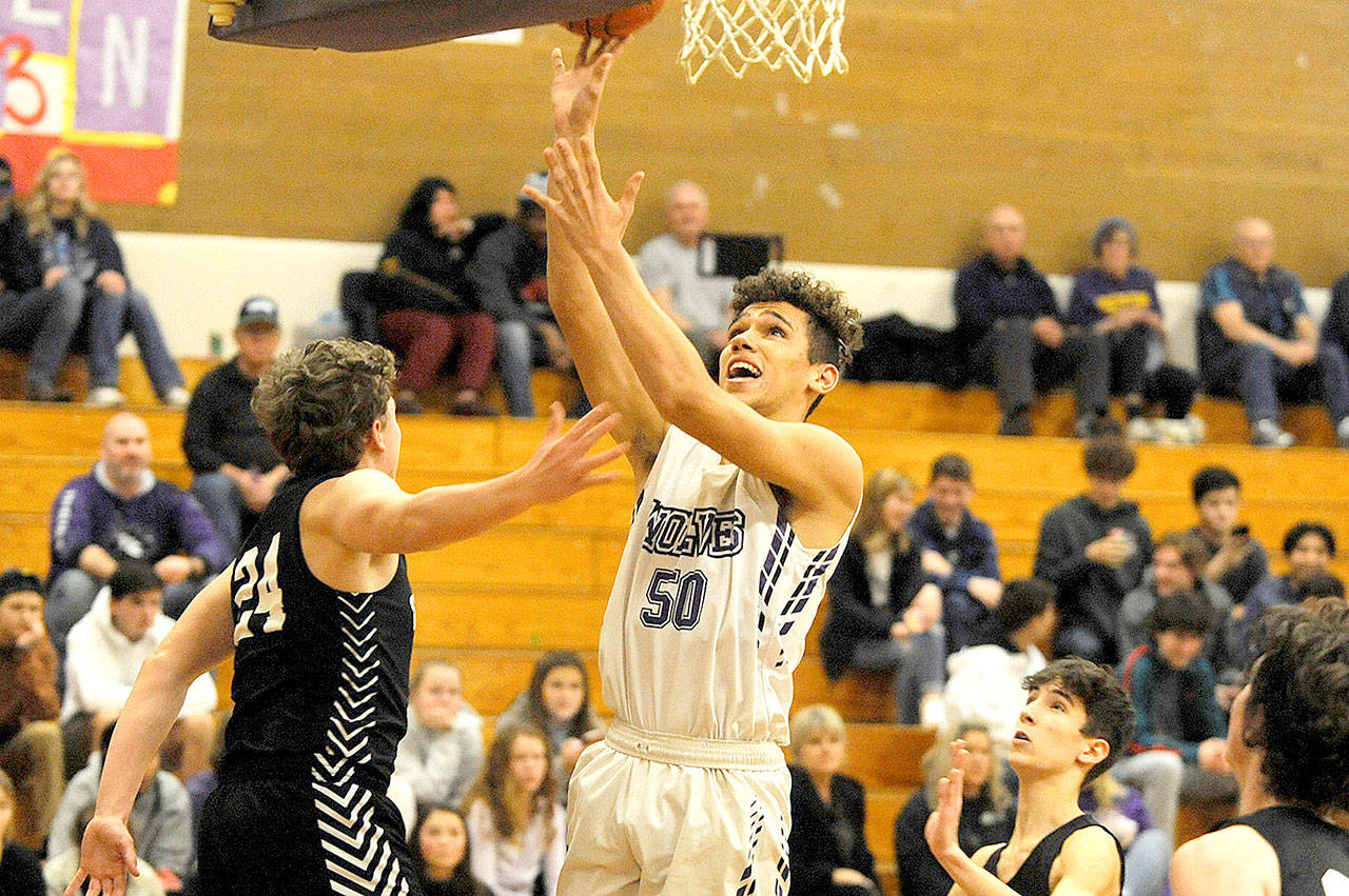 Sequim’s Hayden Eaton goes up for a layup against Central Kitsap on Friday. The Wolves beat the visiting 3A team 57-55. (Conor Dowley/Olympic Peninsula News Group)