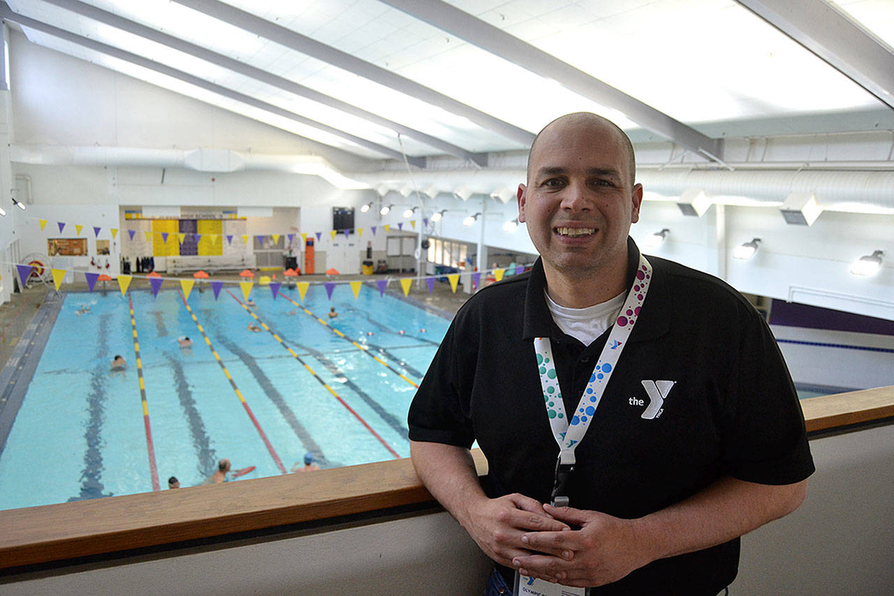 Kurt Turner, executive director of the YMCA of Sequim, overlooks the pool during the last week of work leading the facility. He helped prepare it for opening in October 2016 and gained more than 6,000 members in his tenure. He’s leaving to take over YMCA branches near Austin, Texas. (Matthew Nash/Olympic Peninsula News Group)