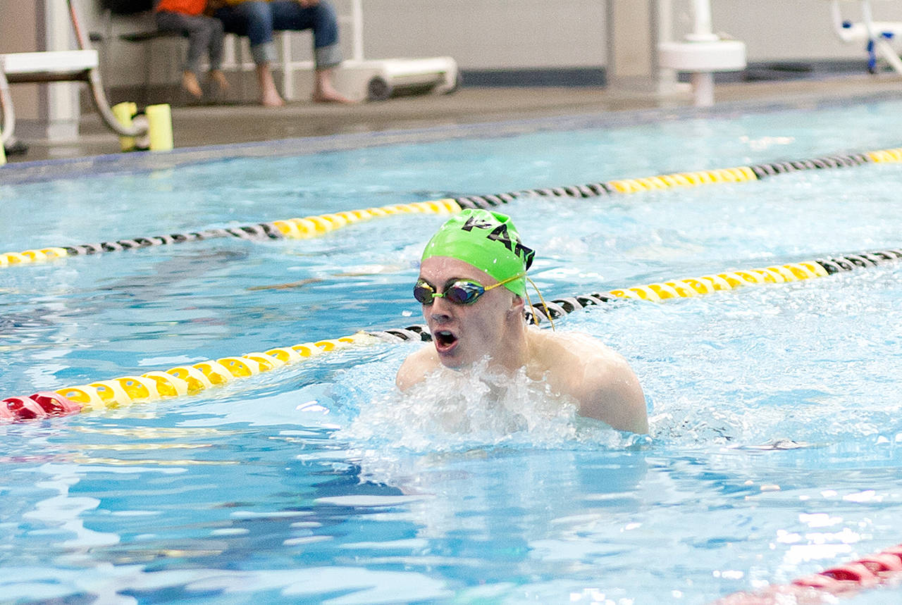 Port Angeles’ Carter Droz swims the breast stroke during a medley relay race against Olympic on Thursday at the Sequim YMCA.                                Photo/Patti Reifenstahl