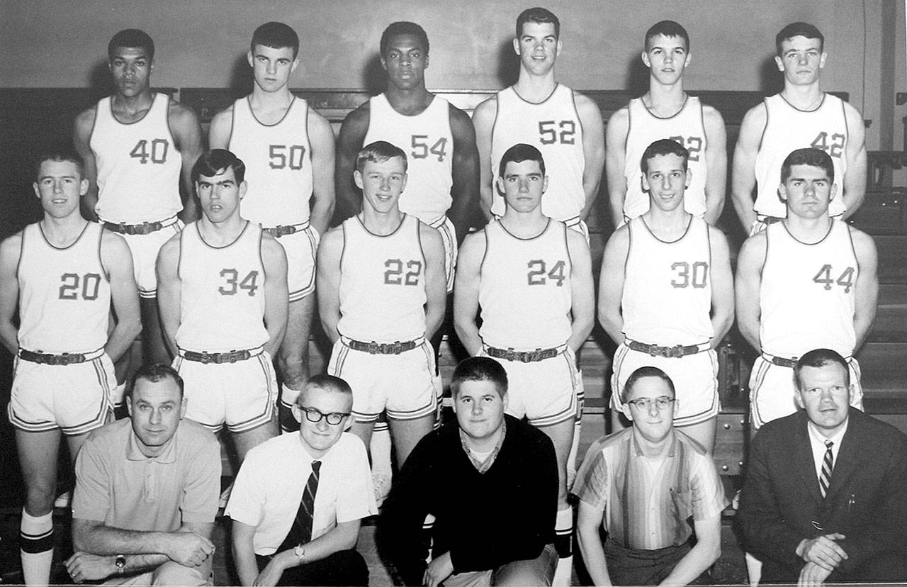 The 1966 Port Angeles boys basketball team will be inducted in the Roughriders Hall of Fame. From left, back row, are Wiley Duckett, Mike Clayton, Clarence Coleman, Lee Sinnes, Bernie Fryer and Bob Ruddell. From left, middle row, are Greg Kushman, Mike Sorenson, Mike Ruddell, Mike Peregrin and Henry Eberhard. From left, front row, are coach Bob Klock, statistician Bruce Skinner, manager Warren Vose, manager Tom Carlson and assistant coach Jack McKay.