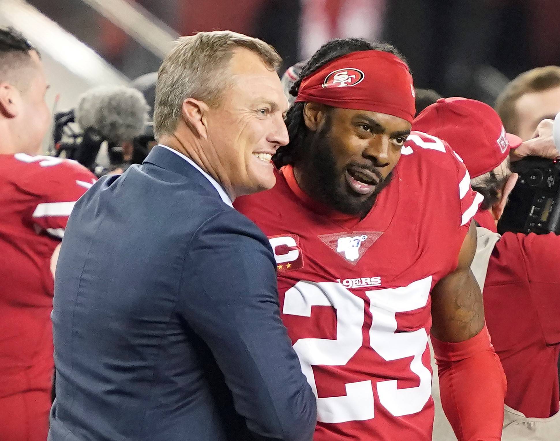 San Francisco 49ers general manager John Lynch, left, celebrates with cornerback Richard Sherman (25) during the second half of the NFL NFC Championship football game against the Green Bay Packers Sunday, Jan. 19, 2020, in Santa Clara, Calif. The 49ers won 37-20 to advance to Super Bowl 54 against the Kansas City Chiefs. (AP Photo/Tony Avelar)