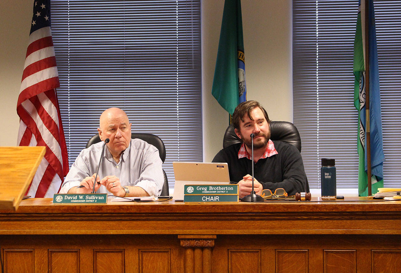 Jefferson County commission chair Greg Brotherton sits next to district 2 commissioner David Sullivan at their meeting Monday as they listen to a report on the Critical Area Ordinance recommendations from the county planning commission. Patty Charnas, Jefferson County community development director, and Mike Nilssen, planning commission chair, presented a brief overview during the meeting. (Zach Jablonski/Peninsula Daily News)