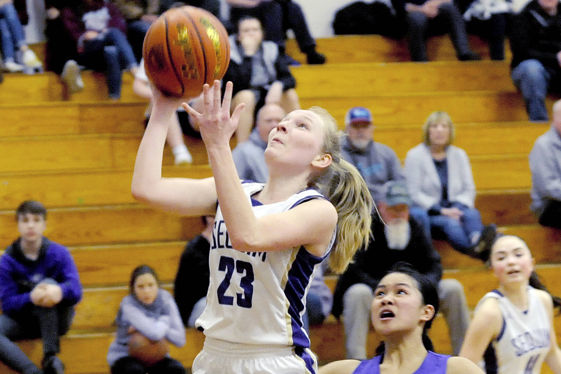 <strong>Conor Dowley</strong>/Olympic Peninsula News Group                                Sequim’s Melissa Porter goes up for a layup against Foster on Wednesday. Porter scored 14 of her game-high 19 points on the night off of fast breaks.