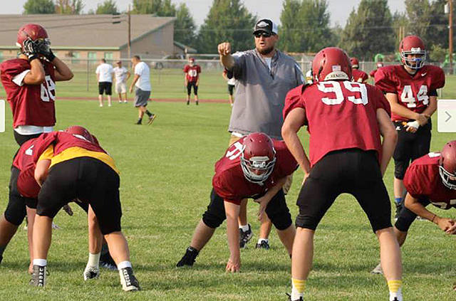 Brent Wasche leads drills during a 2018 Redmond (Ore.) football practice. Wasche, a former Port Angeles assistant coach and head wrestling coach, has been selected to lead the Roughriders football program.