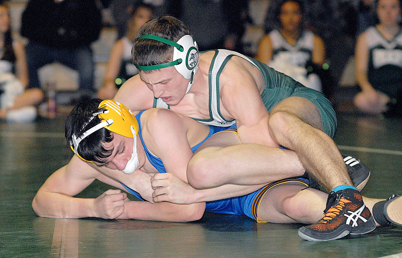 Adam Borde of Port Angeles, top, wrestles with Jacoby Serato of Bremerton during a match earlier this season. Borde is one of 20 North Olympic Peninsula wrestlers set to compete at Mat Classic XXXII, the state wrestling tournament, today and Saturday at the Tacoma Dome. (Keith Thorpe/Peninsula Daily News)