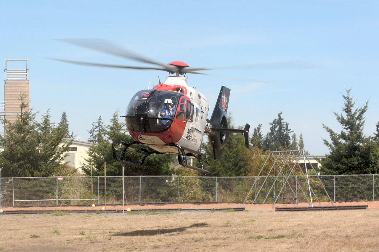 Airlift Northwest lands at Greywolf Elementary School near Carlsborg during a drill in 2016. (Peninsula Daily News file)