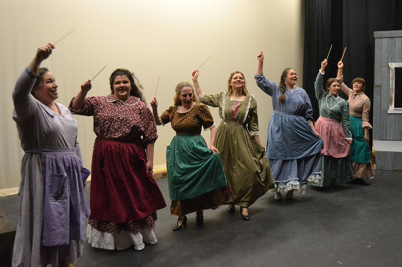 Actresses in “Quilters” — from left, SaraJane Benjamin, Maddie Montana, Susan Cates, Sarah Shea, Marissa Wilson, Charisa Silliman, and Gabi Simonson — perform the song “Thread the Needle.” Matthew Nash/Olympic Peninsula News Group                                Actresses in “Quilters” — from left, SaraJane Benjamin, Maddie Montana, Susan Cates, Sarah Shea, Marissa Wilson, Charisa Silliman, and Gabi Simonson — perform the song “Thread the Needle.” (Matthew Nash/Olympic Peninsula News Group)