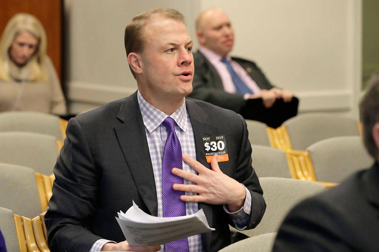 In this Feb. 4, 2020, file photo, initiative promoter Tim Eyman waits to speak during a hearing before the Washington State Senate Transportation Committee at the Capitol in Olympia. A judge has ruled that Eyman illegally failed to report more than $766,000 in campaign contributions over a six-year period. Thurston County Superior Court Judge James Dixon issued his ruling Friday, Feb. 21, 2020, in a lawsuit brought against Eyman by Washington Attorney General Bob Ferguson. (Ted S. Warren, Associated Press file)