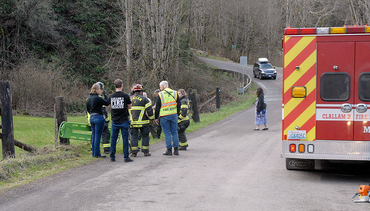 Law enforcement and rescue personnel from Clallam County Fire District No. 2 prepare to recover a body that was found in Ennis Creek south of East Ennis Creek Road near the east city limits of Port Angeles on Saturday. (Keith Thorpe/Peninsula Daily News)