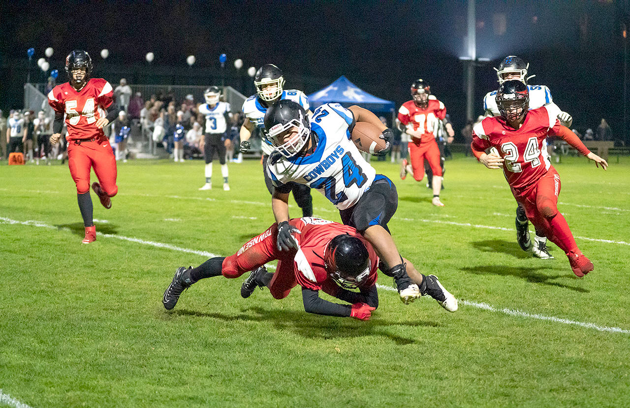 Chimacum’s Anson Jones runs with the football during a game against Port Townsend last fall. The Cowboys will compete in the Class 1B/2B Northwest League next season, school administrators announced. (Steve Mullensky/for Peninsula Daily News)