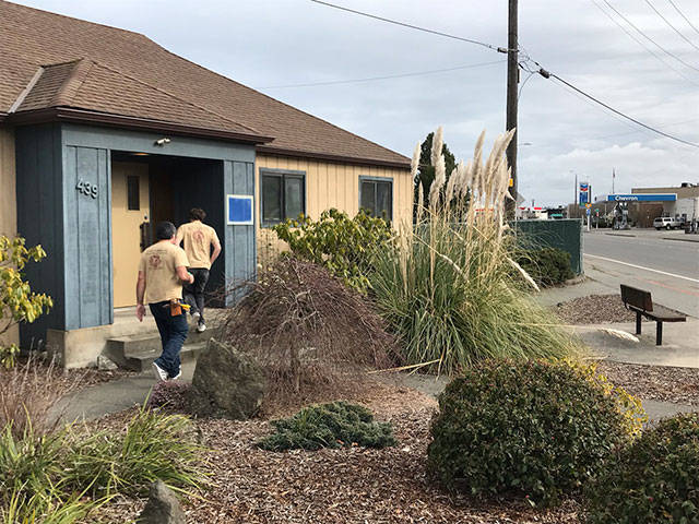 Workers were preparing former timber company offices Tuesday, Feb. 25, 2020, for a new tenant, Arrow Launch Services Inc. (Paul Gottlieb/Peninsula Daily News)