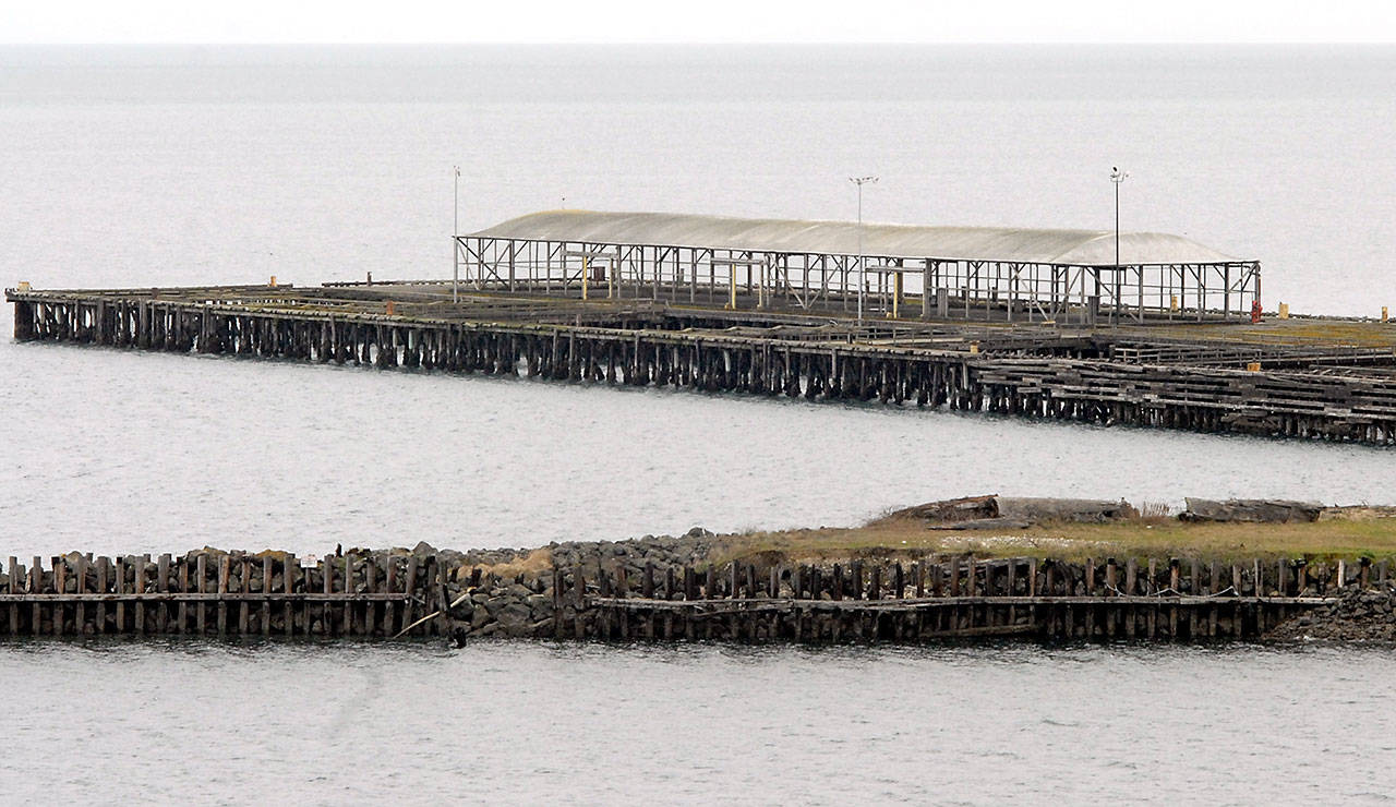 The former dock and jetty, shown Thursday, Feb. 27, 2020, are among the few structures that remain at the site of the former Rayonier pulp mill in Port Angeles. (Keith Thorpe/Peninsula Daily News)