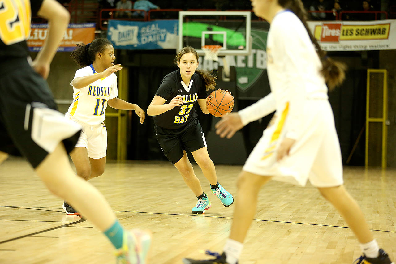 Clallam Bay’s Amber Swan, right, drives during the Bruins’ 67-58 Class 1B State Girls Basketball Tournament loss to Wellpinit on Wednesday at Spokane Arena. (Chris Johnson/for Peninsula Daily News)