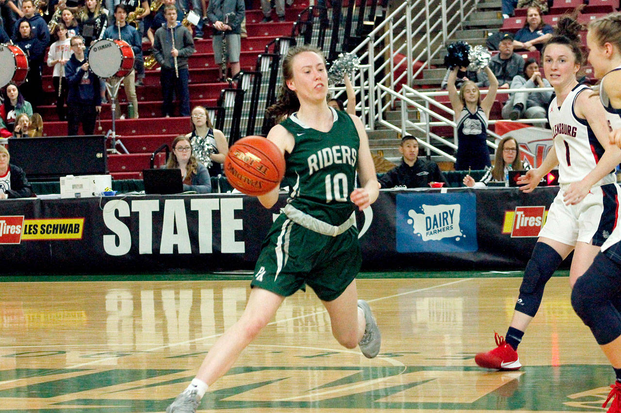 Mikkiah Brady sends the ball out to a teammate at the wing late in the fourth quarter against Ellensburg. (Mark Krulish/Kitsap News Group)