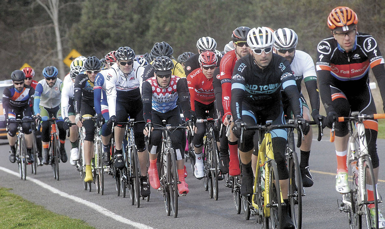 Participants in the senior category 3 race set out from the starting line near the Dungeness Recreation Area north of Sequim during the 2016 Tour de Dung Road Races. (Keith Thorpe/Peninsula Daily News file)