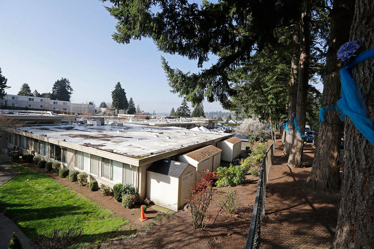 The single-story Life Care Center is seen Wednesday, March 18, 2020, in Kirkland. Staff members who worked while sick at multiple long-term care facilities contributed to the spread of COVID-19 among vulnerable elderly in the Seattle area, federal health officials said Wednesday. (Elaine Thompson/The Associated Press)