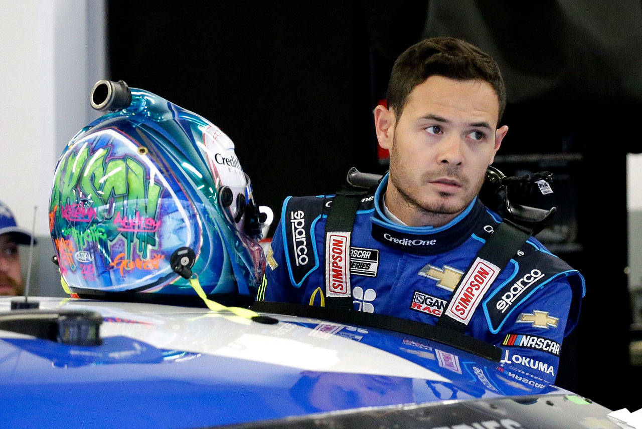 In this Feb. 14, 2020, file photo, Kyle Larson gets ready to climb into his car to practice for the NASCAR Daytona 500 auto race at Daytona International Speedway in Daytona Beach, Fla. Kyle Larson used a racial slur on a live stream Sunday, April 12, 2020, during a virtual race — the second driver in a week to draw scrutiny while using the online racing platform to fill time during the coronavirus pandemic. (Terry Renna/The Associated Press file)