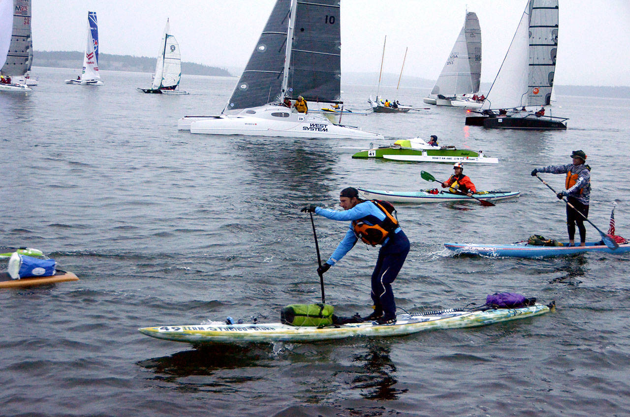 Paddle boarder Luke Burritt of team Fueled on Stoke takes off at the start of the Race to Alaska in 2017.