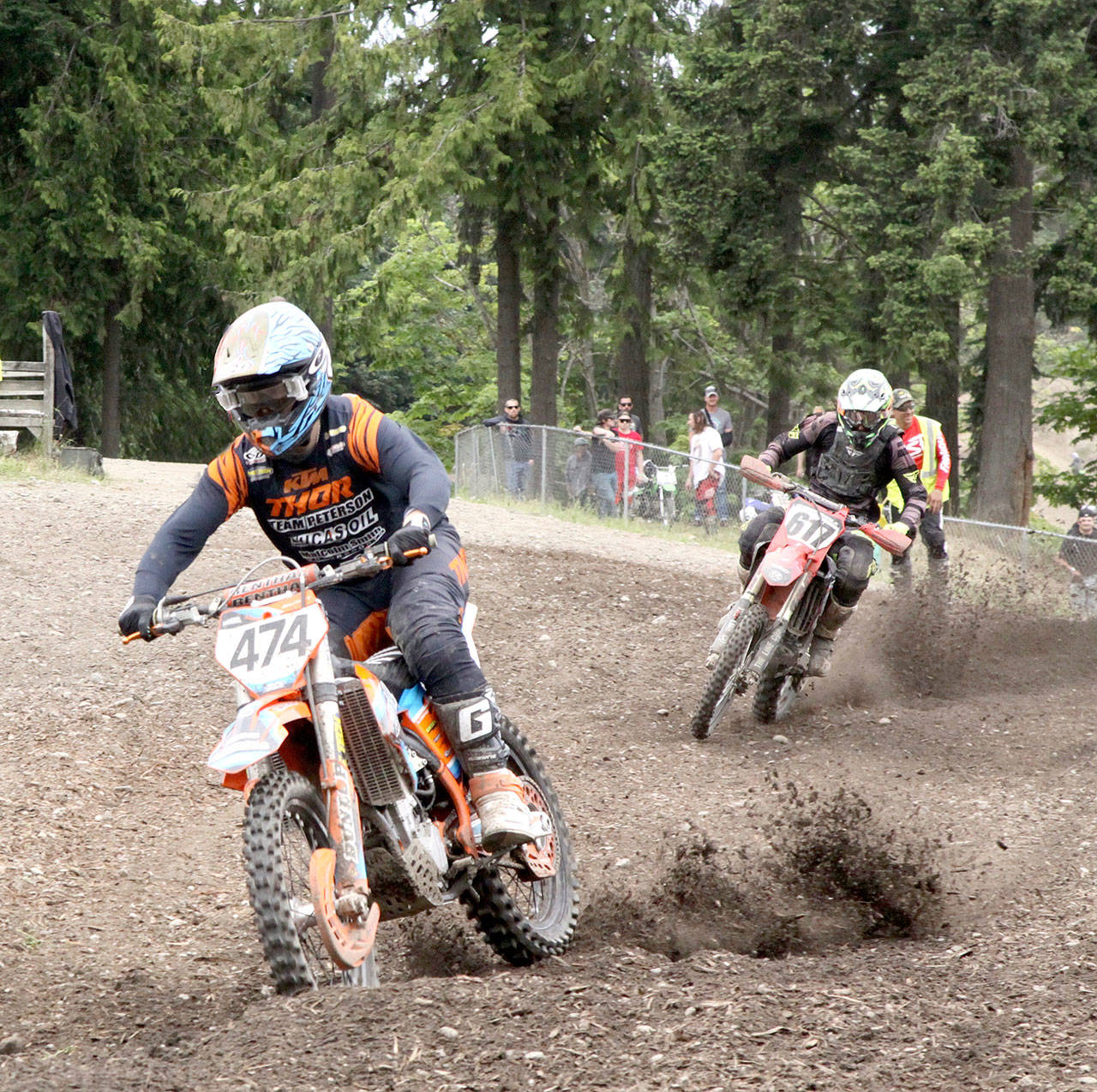 Dave Logan/for Peninsula Daily News Port Angeles’ Jake Anstett leads Hayden Cordell of Rochester in the early laps of the Pro Class race at the Olympic Peninsula Motorcycle Club complex on Deer Park Road on Saturday. There were 34 classes of riders with a total just over 250 racing in the two-day Pacific Racing Organization event this weekend, the first motorcycle races held at Deer Park in months due to COVID-19 closures.                                 (Dave Logan/for Peninsula Daily News)