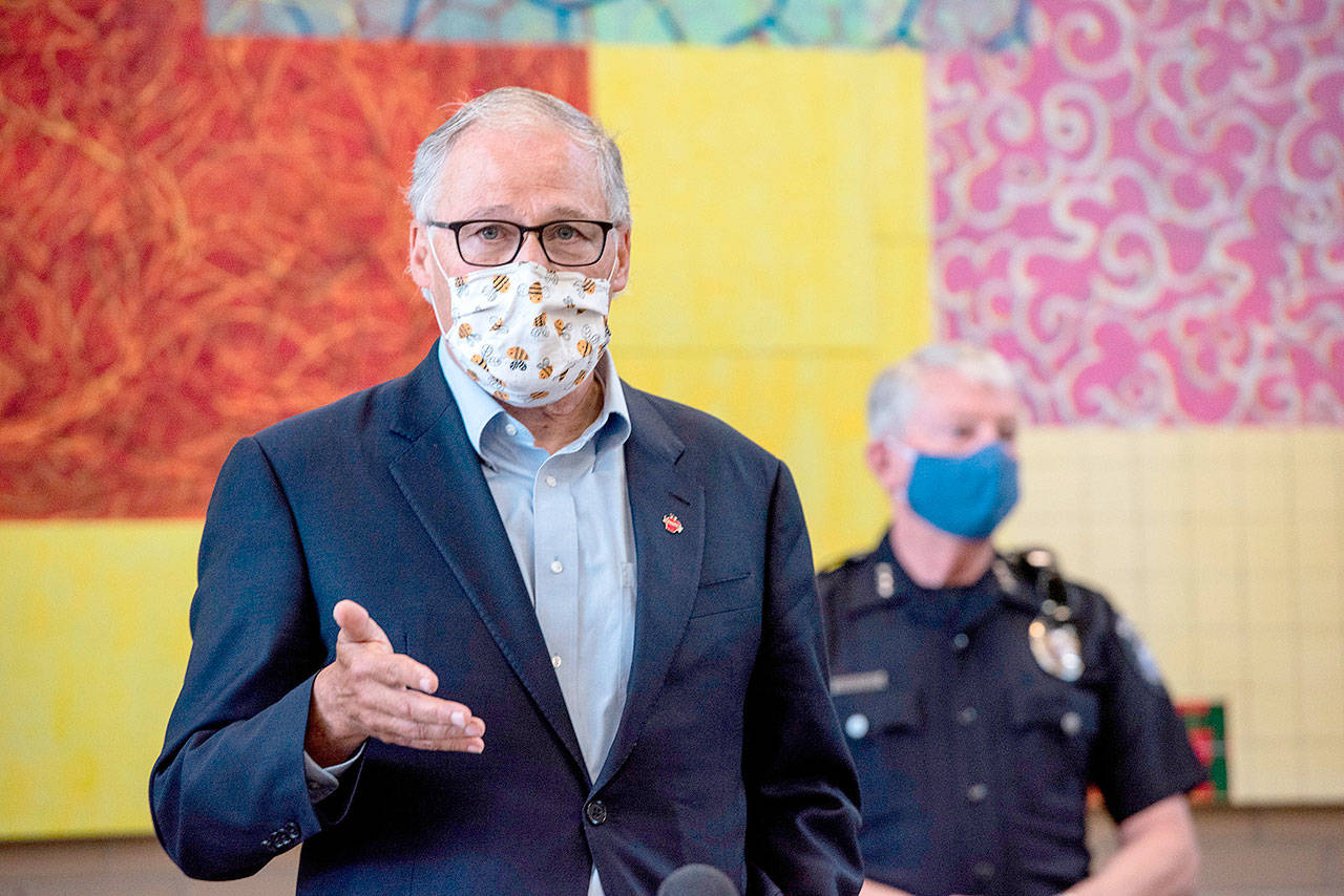 Washington Gov. Jay Inslee speaks at the Columbia Basin College campus in the Tri-Cities on Tuesday, June 30, 2020 about the spread of the coronavirus in Benton and Franklin counties. (Jennifer King/The Tri-City Herald via AP)