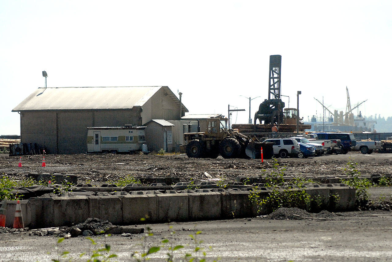 Vehicles and equipment sit at the Port of Port Angeles log yard on Marine Drive on Tuesday, July 14, 2020. (Keith Thorpe/Peninsula Daily News)