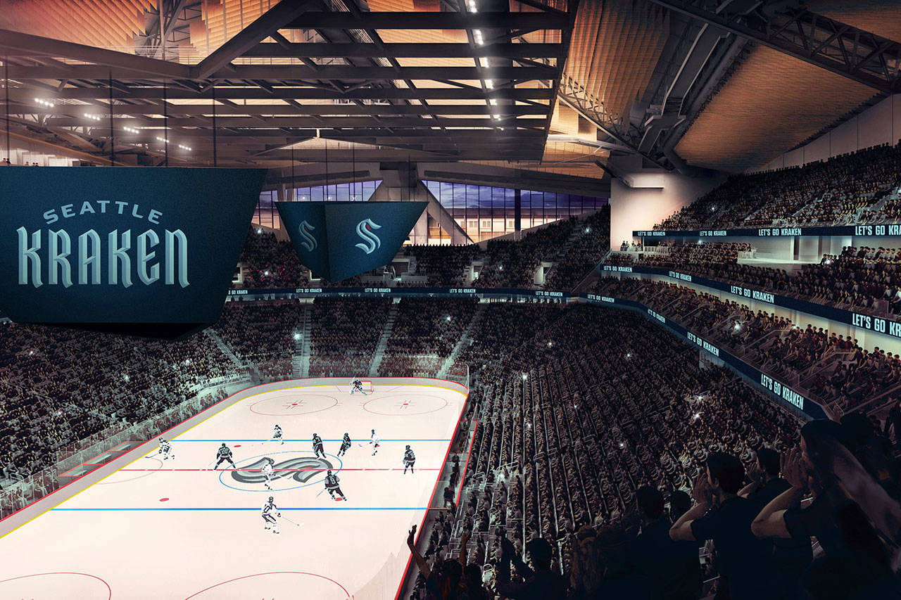 This artists rendering released Thursday, July 23, 2020, by the Seattle Kraken, shows the NHL hockey team’s new logo, left, and name, displayed in what would be their finished arena. (Seattle Kraken via AP)